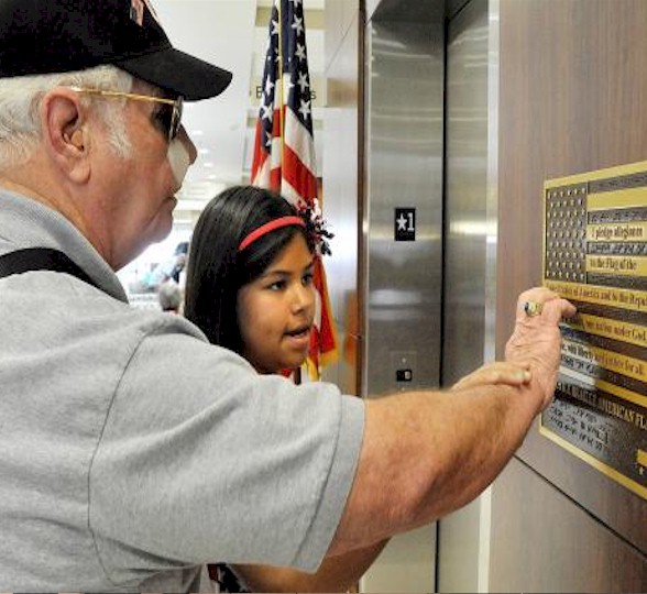 Blind Vet feels Flag