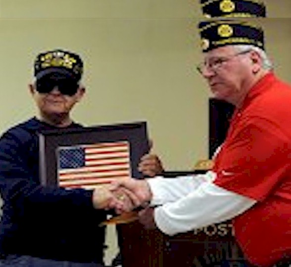Walt Peters Receives Braille Flag